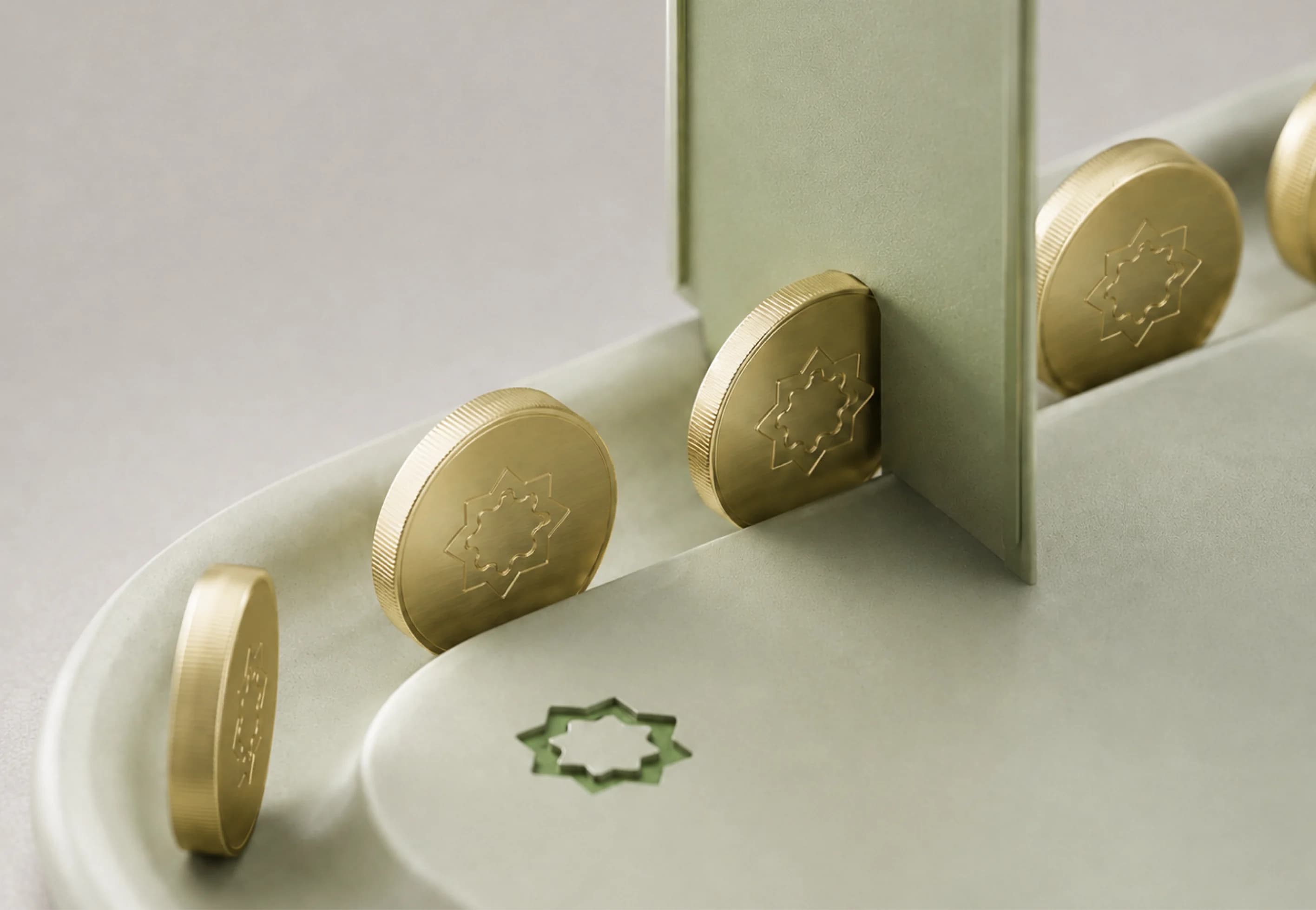 Asyah brand coins on a cream surface